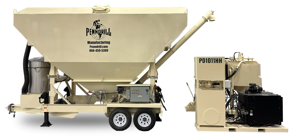 Union-PD1011-PD800-shadow - Pennsylvania Drilling Company 2 pieces of large tan grouting equipment staged together. The left equipment is a large cement silo with a graduated bottom and an auger feed. The right equipment is a grout plant with a black engine and large cylindrical tanks.