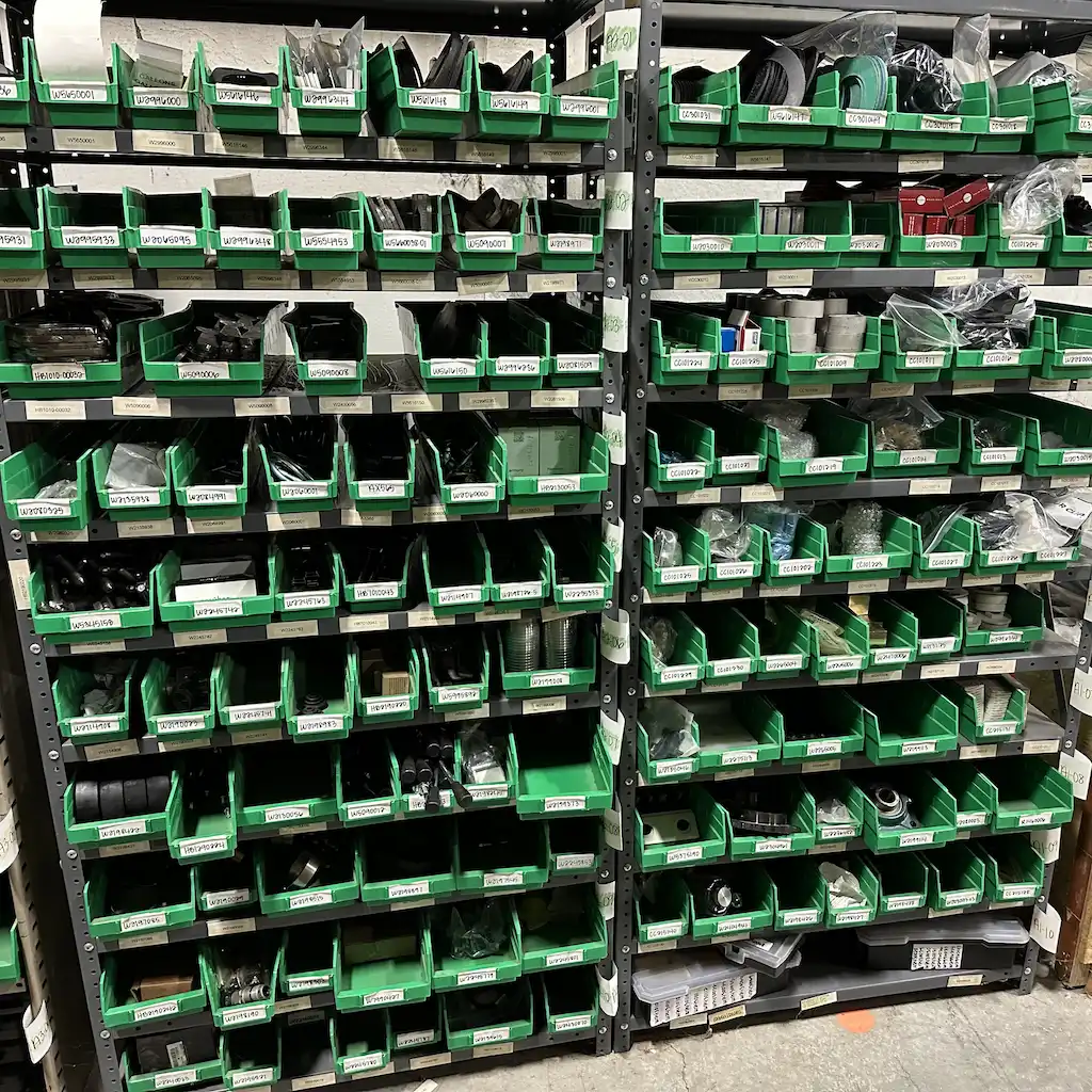 grout-mixer-maintenance-3 - Pennsylvania Drilling Company Shelves stocked with wear parts for grouting equipment.